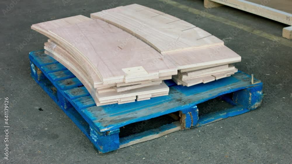 Pallet jack moving plywood cut into shapes on pallet, Nottinghamshire, UK Pallet jack moving plywood cut into shapes on pallet, Nottinghamshire, UK