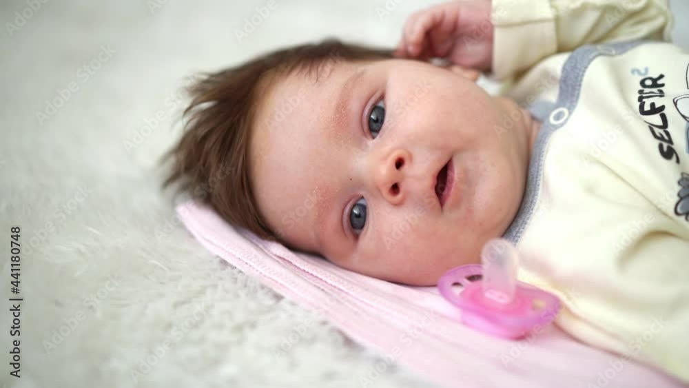 Happy infant baby smiling looking at camera Happy infant baby smiling looking at camera