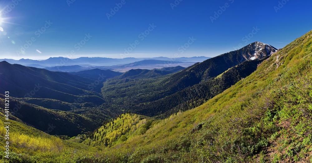 Fototapeta premium Rocky Mountains Lowe Peak views of Oquirrh range toward Utah Lake, Timpanogos, Wasatch Front by Rio Tinto Bingham Copper Mine, in spring. Utah. United States. USA.
