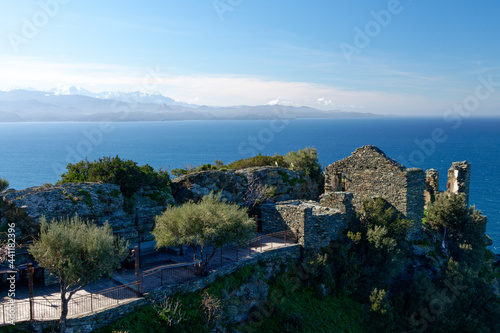 Ruins in the village of Nonza with the Monte Cinto in the background, Cap Corse in Corsica, France