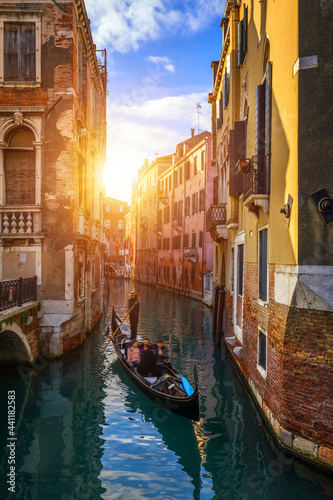 Canal with gondolas in Venice  Italy. Architecture and landmarks of Venice. Venice postcard with Venice gondolas.