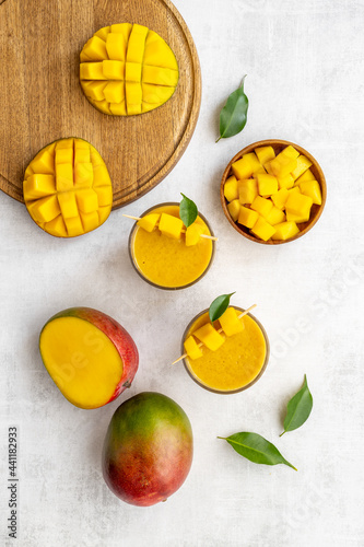 Mango smoothie with fresh mango fruits. Top view