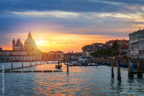 Sunset in Venice. Image of Grand Canal in Venice, with Santa Maria della Salute Basilica in the background. Venice is a popular tourist destination of Europe. Venice, Italy. © daliu