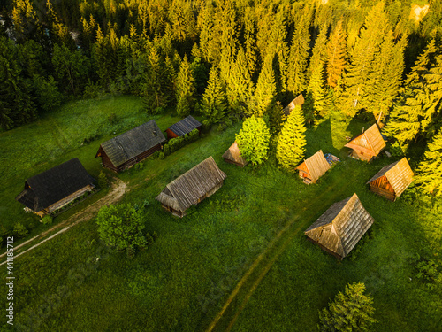 Fototapeta Naklejka Na Ścianę i Meble -  Traditional Wooden Log Cabins at Old Shepherd Hut Village in Jurgow, Podhale in Poland