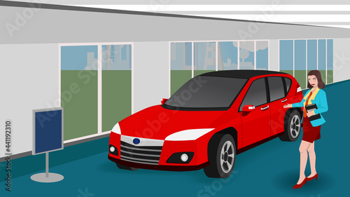 ฺBeautiful young car salesgirl stood holding documents and Show a sign inviting you to buy. Red passenger cars are ready for sale inside showroom.
