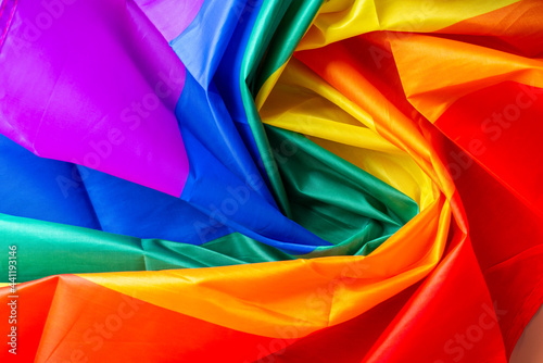 LGBTQ flag and symbol on table top view