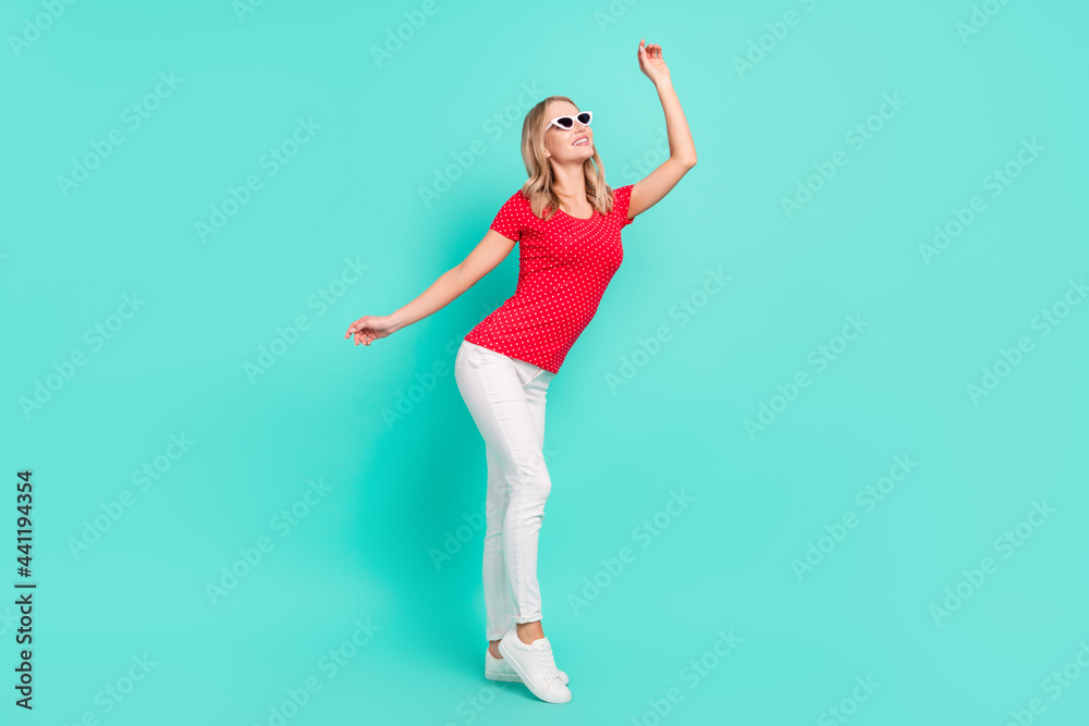 Full length body size photo woman dancing wearing stylish sunglass isolated bright teal color background Full length body size photo woman dancing wearing stylish sunglass isolated bright teal color background