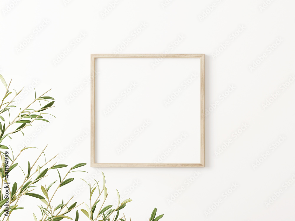 Fototapeta Square wooden frame mockup with green olive tree branches on empty white wall background. 3D rendering, illustration