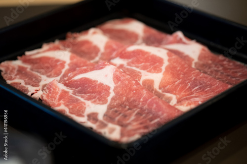 Close up of premium fresh sliced meat beef in black tray are prepared for cooking