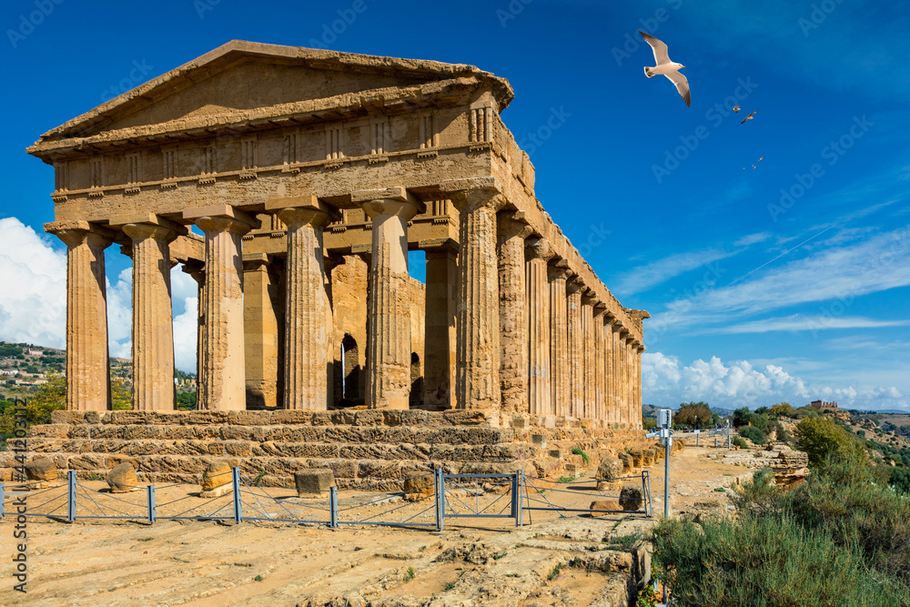 Fototapeta premium Valley of the Temples (Valle dei Templi), The Temple of Concordia, an ancient Greek Temple built in the 5th century BC, Agrigento, Sicily. Temple of Concordia, Agrigento, Sicily, Italy