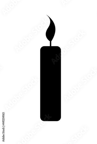 burning candle on black background