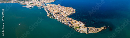 Siracusa, Ortigia Island from the air, Sicily, Italy. Isola di Ortigia, coast of Ortigia island at city of Syracuse, Sicily, Italy. Coastline town Syracuse, Sicily and old Ortigia island. Aerial view.