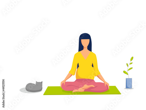 A pregnant girl does yoga at home on a feel-good mat.