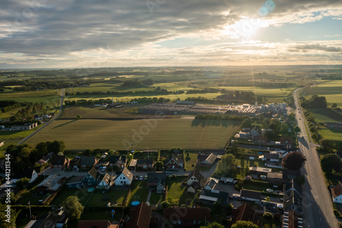 Dawn in the sleeping area of a small town with a forest on the view from a height