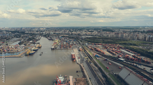 Aerial view of high-tech modern seaport with cranes and loaders