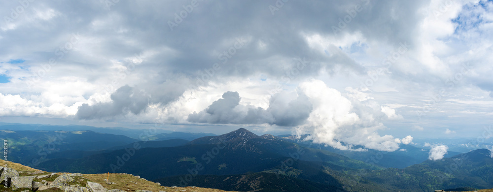 Panorama of the Carpathian mountains at the beginning of summer in Ukraine, rest and travel in the mountains