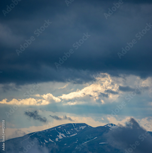 Fog rises over the Carpathian mountains after rain in the evening