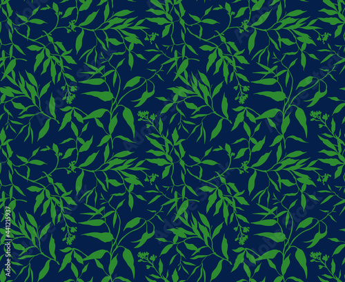 Seamless floral pattern. Tropical background of green leaves. Leaf on navy blue background. Bright silhouette of leaves in tropical style. Stock vector for printing on surfaces and web design. 
