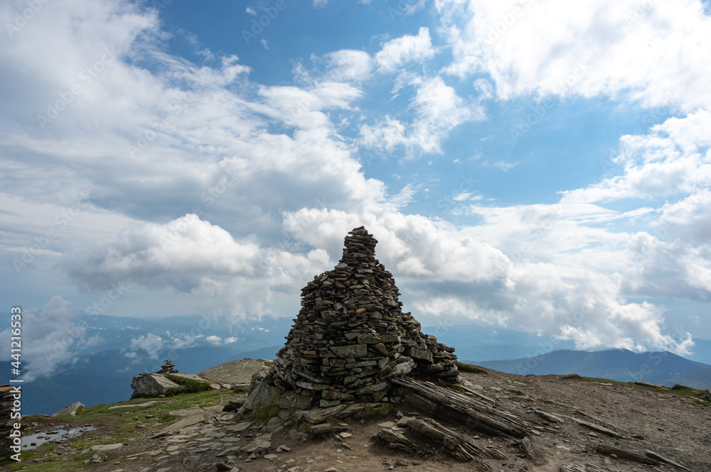 A pile of stones on a mountain top in the carpathian mountains in summer