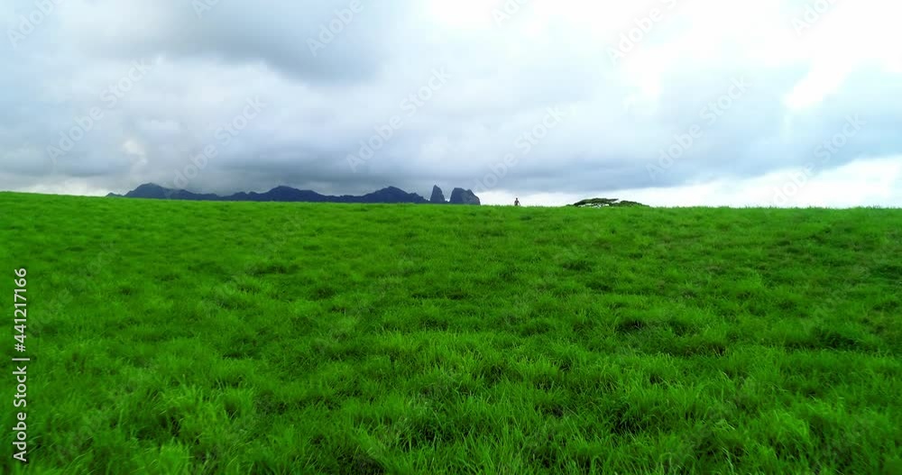 Aerial: Male Tourist On Vacation At Kauai Island, Drone Flying Over Natural Landscape Against Cloudy Sky Aerial: Male Tourist On Vacation At Kauai Island, Drone Flying Over Natural Landscape Against Cloudy Sky