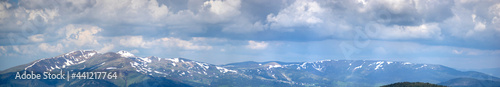 Panorama of the Carpathian mountains at the beginning of summer in Ukraine, rest and travel in the mountains