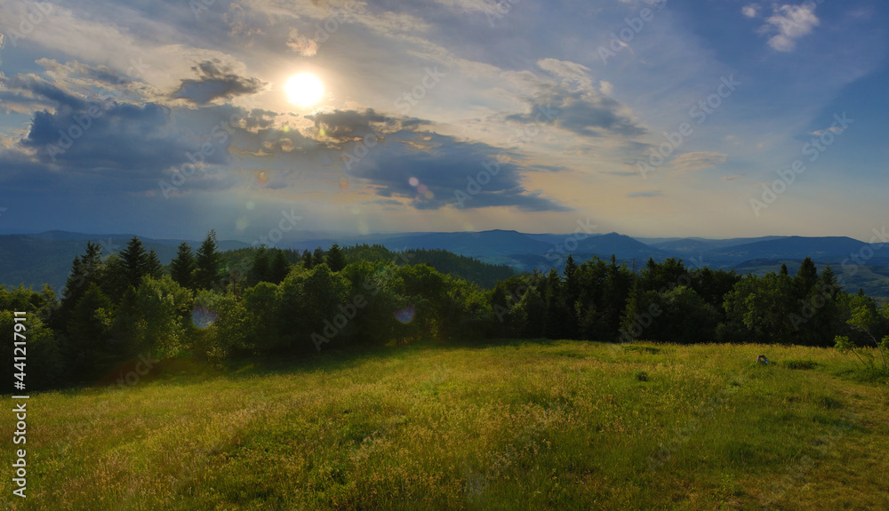Green mountains landscape. Sunset over the hill. Mountains landscape panorama. Sunset in the mountains.