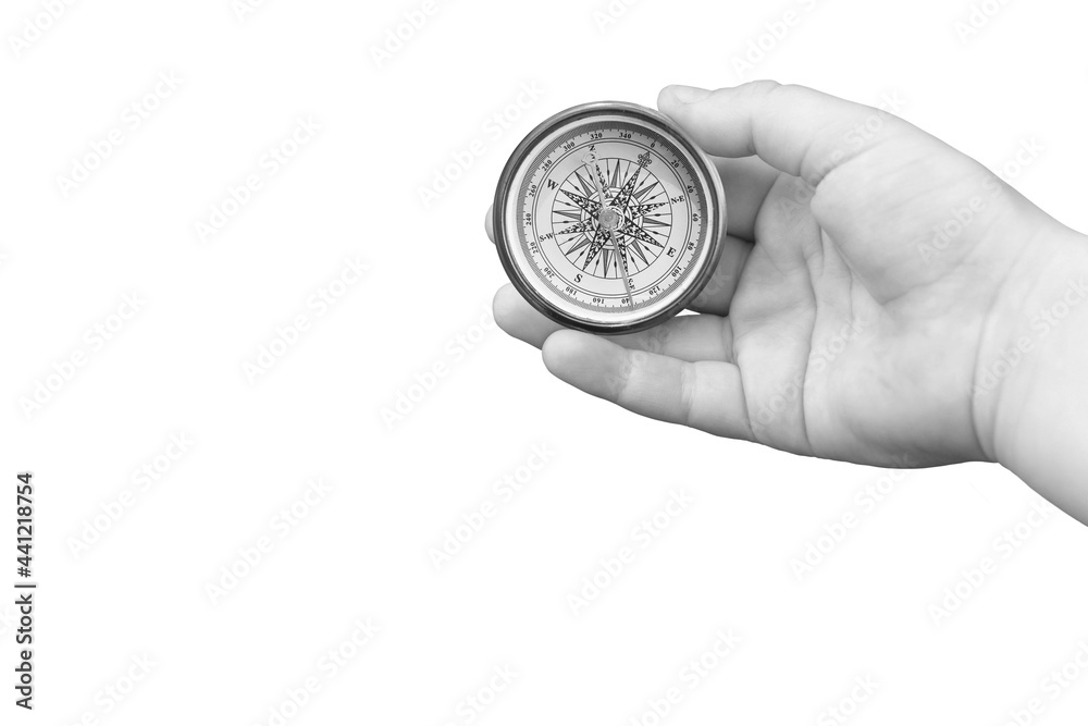 round compass in hand isolated on white background for abstract image with place for text as symbol of tourism with compass, travel with compass and outdoor activities with compass