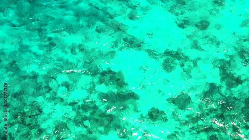 Blue sea water texture aerial drone view. Sea water surface in lagoon with coral reef. Blue sea water texture aerial drone view. Sea water surface in lagoon with coral reef.