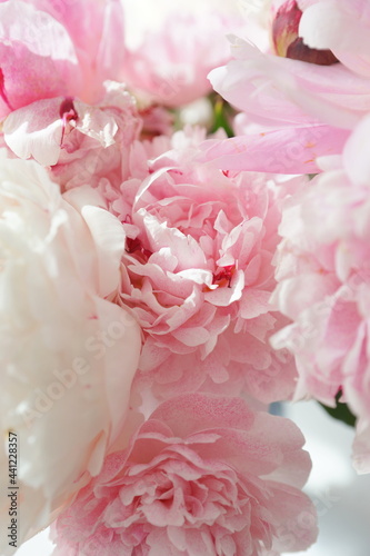 Fototapeta Naklejka Na Ścianę i Meble -  Bouquet of pink peonies on the dresser in the bedroom