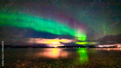 Nordlichter   ber dem Fjord in Troms bei Troms  . Aurora Borealis in the sky  heavenly light in the dark night. the lady dance in the sky. Polarlicht  Nordlicht in Norwegen