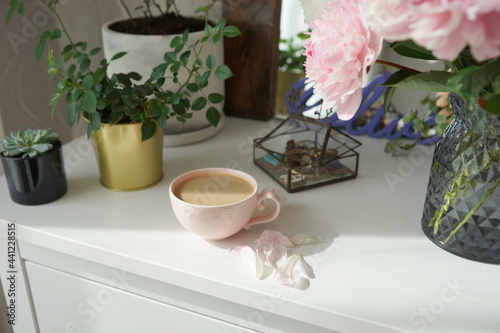 Fototapeta Naklejka Na Ścianę i Meble -  Bouquet of pink peonies on the dresser in the bedroom