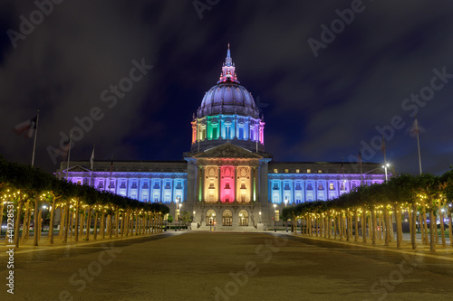 Summer blue foggy skies over San Francisco City Hall lit up in rainbow colors for the 2021 Pride