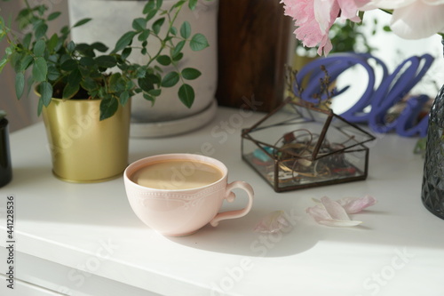 Fototapeta Naklejka Na Ścianę i Meble -  Bouquet of pink peonies on the dresser in the bedroom