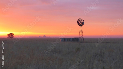 Sunrise over Free State wind pump photo