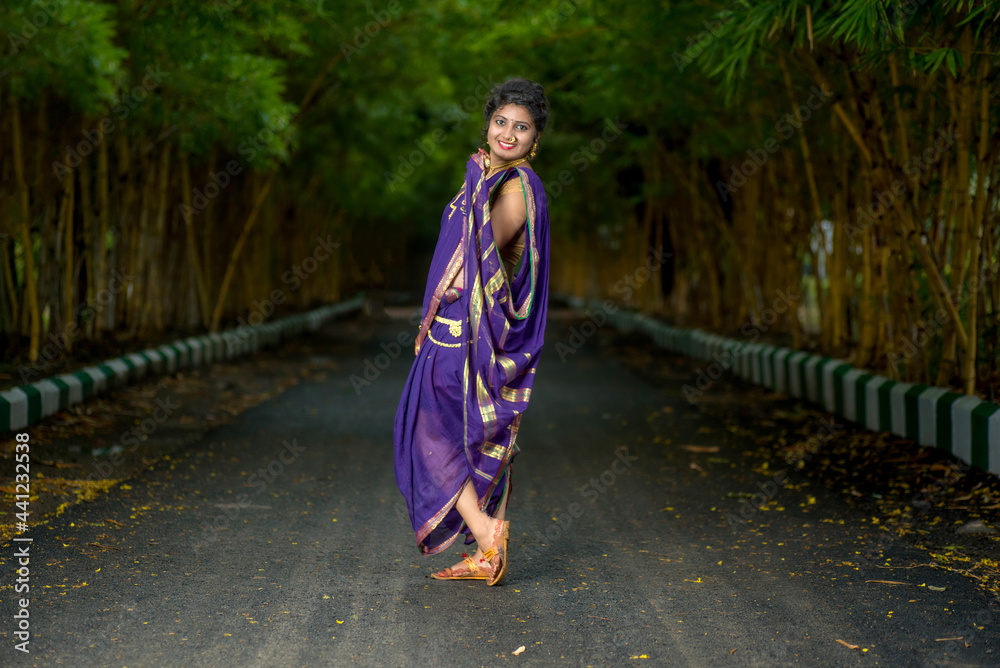 Indian Traditional Beautiful young girl in saree posing outdoors Indian Traditional Beautiful young girl in saree posing outdoors