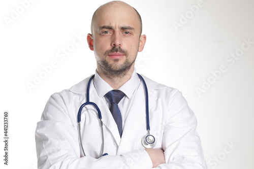 Medical doctor with stethoscope. Isolated on white background