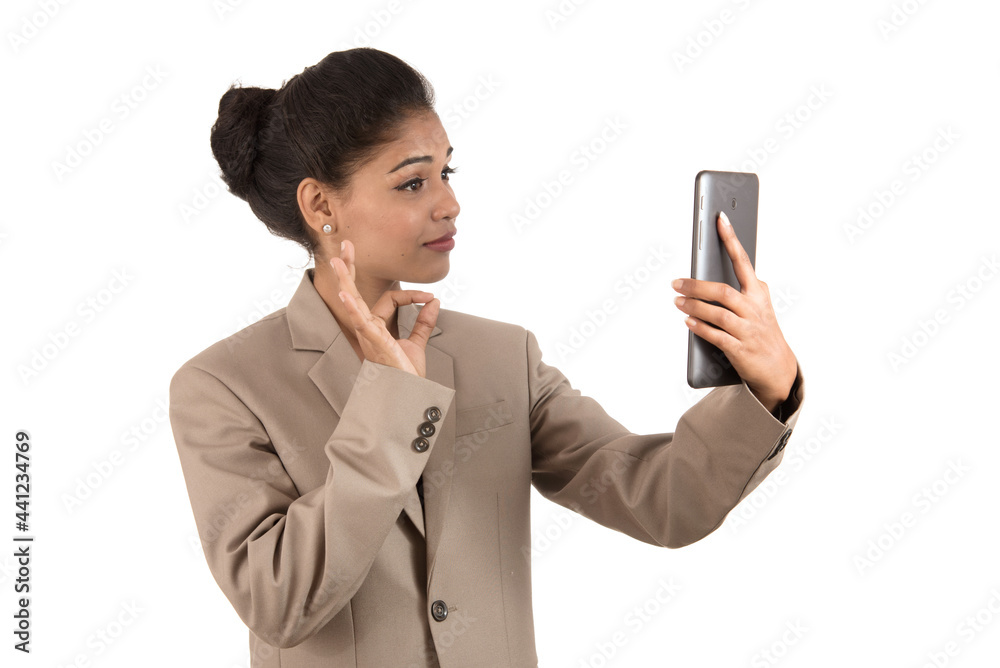 Beautiful woman talking in a video conference online by using smartphone Beautiful woman talking in a video conference online by using smartphone