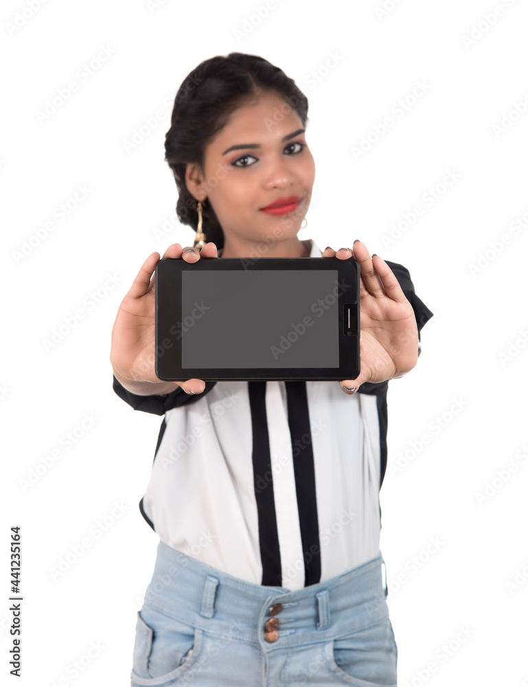 Young beautiful woman holding blank screen smart phone on white background Young beautiful woman holding blank screen smart phone on white background