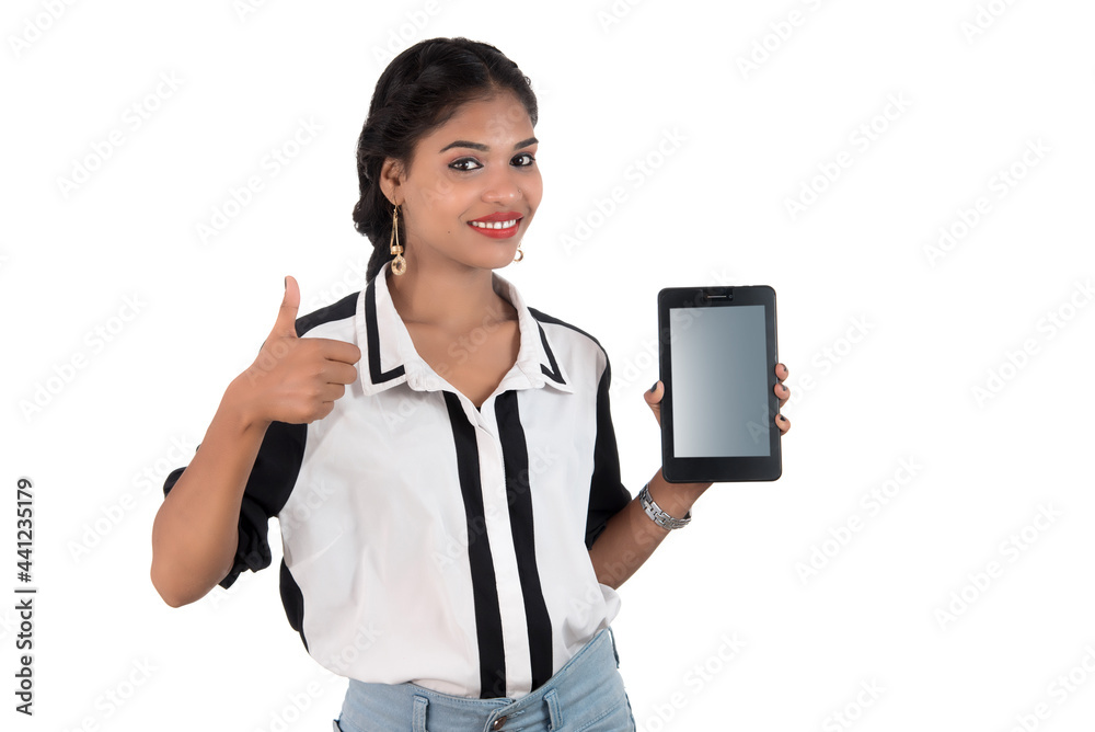 Young beautiful woman holding blank screen smart phone on white background Young beautiful woman holding blank screen smart phone on white background