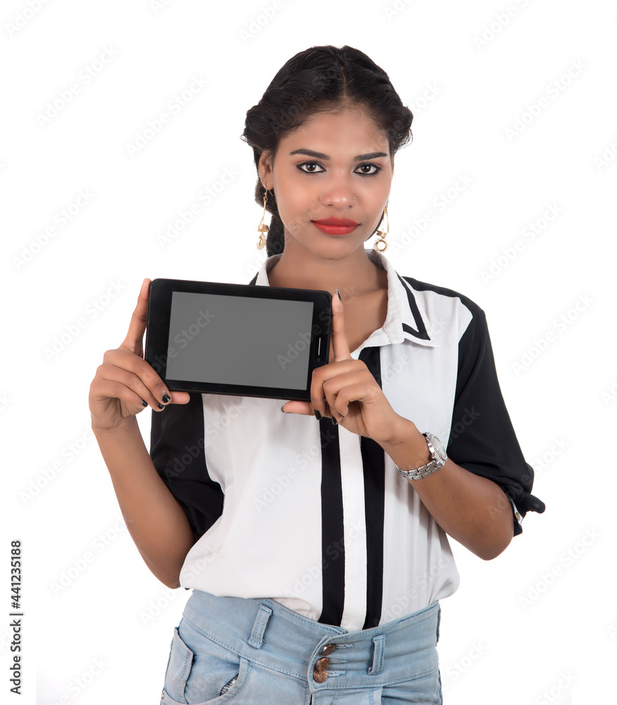 Young beautiful woman holding blank screen smart phone on white background Young beautiful woman holding blank screen smart phone on white background