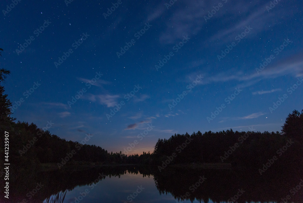 A small forest lake in Belarus at summer night A small forest lake in Belarus at summer night