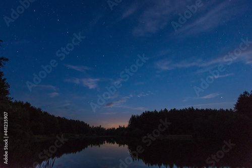 A small forest lake in Belarus at summer night