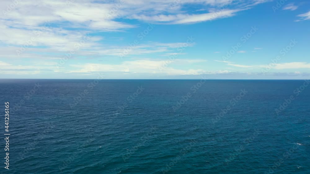 Seascape, aerial view. Flight over the sea. Blue sea and sky with clouds. Summer and travel vacation concept. Seascape, aerial view. Flight over the sea. Blue sea and sky with clouds. Summer and travel vacation concept.