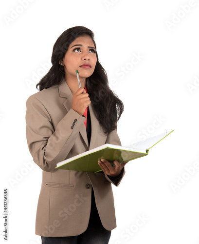 thoughtful woman student, teacher or business lady holding books. Isolated on white backgrounds
