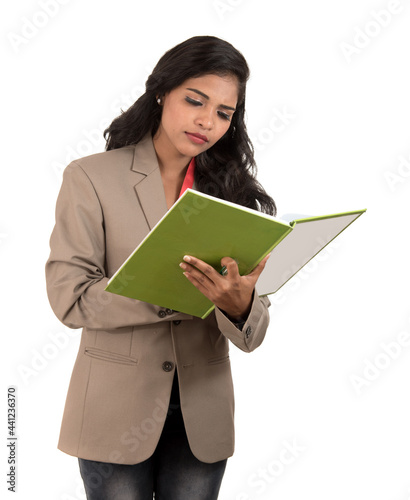 thoughtful woman student, teacher or business lady holding books. Isolated on white backgrounds