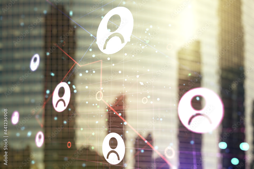 Double exposure of social network icons hologram on blurry cityscape background. Networking concept