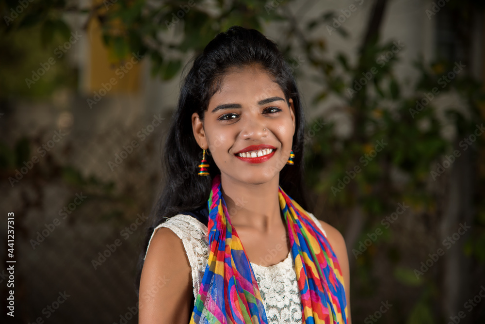 Portrait of beautiful Young girl outdoors in park.