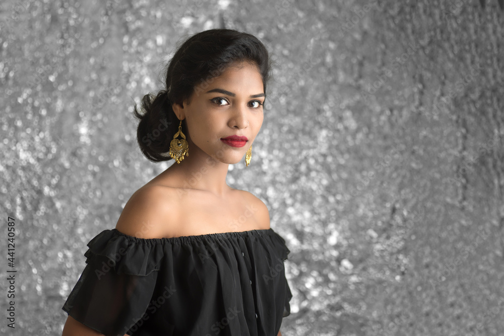 Portrait of beautiful young Girl. Closeup face of a pretty Indian model on texture background Portrait of beautiful young Girl. Closeup face of a pretty Indian model on texture background