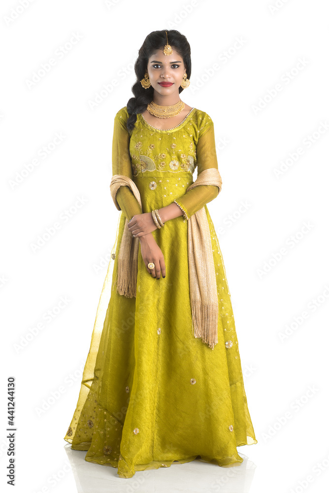Portrait of beautiful traditional Indian girl posing on white background. Portrait of beautiful traditional Indian girl posing on white background.
