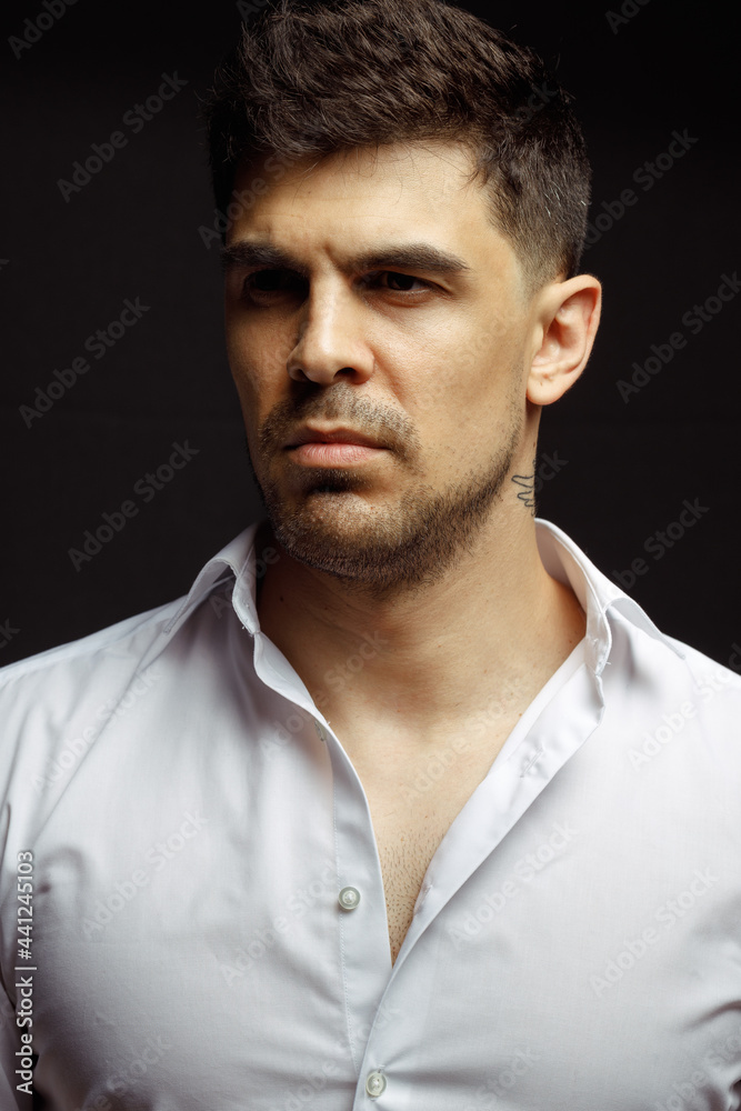 Portrait of an casual man, Stylish businessman, Portrait of the beautiful posing in a Studio, Black background, Stylish man